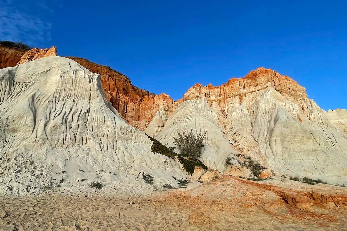 White and red sandstone cliffs on Falesia Beach in Algarve
