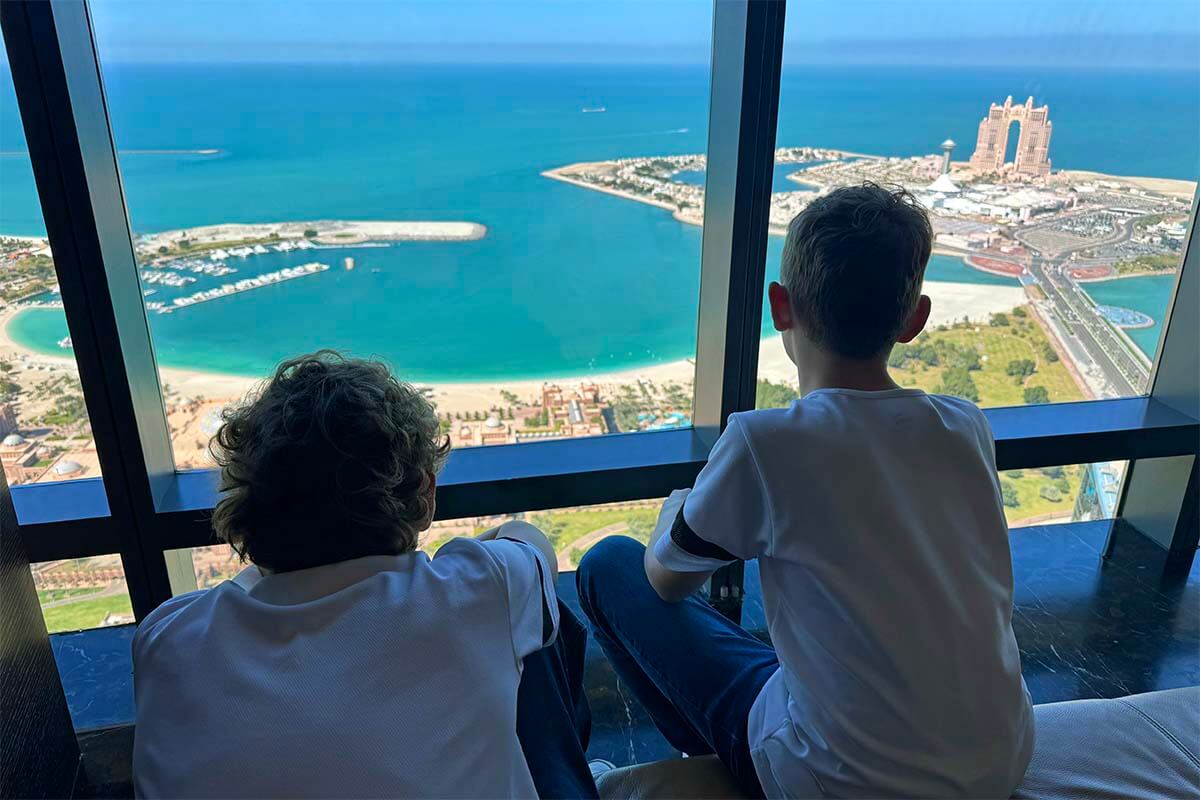 Abu Dhabi tour from Dubai - kids enjoying the view from Etihad Towers