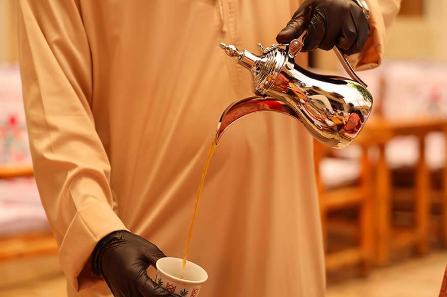 Emirati man pouring traditional Arabic coffee - Dubai UAE