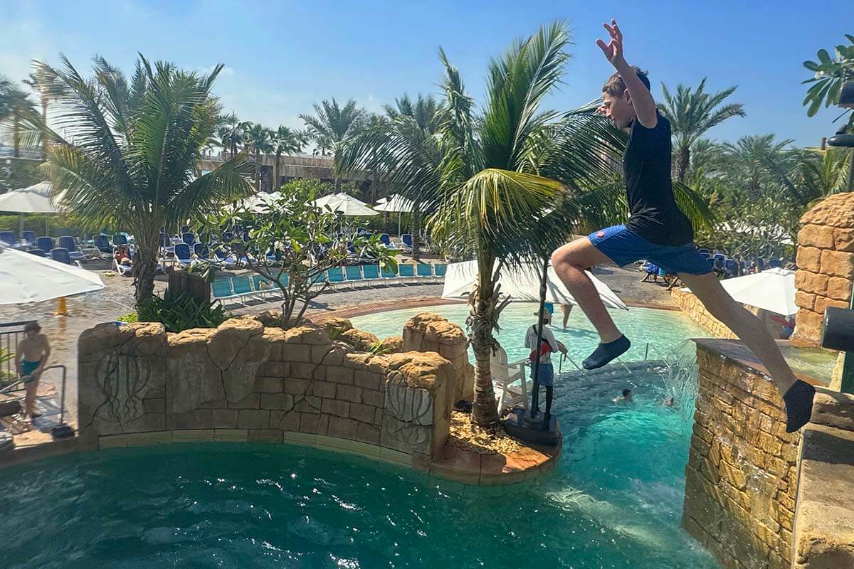Kids cliff jumping at Immortal Falls at Atlantis Aquaventure Dubai