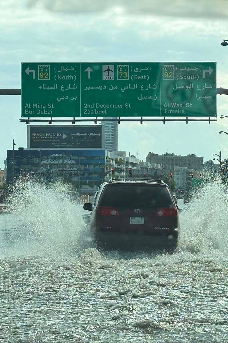 Rain in United Arab Emirates - cars driving through flooded streets in Dubai in February