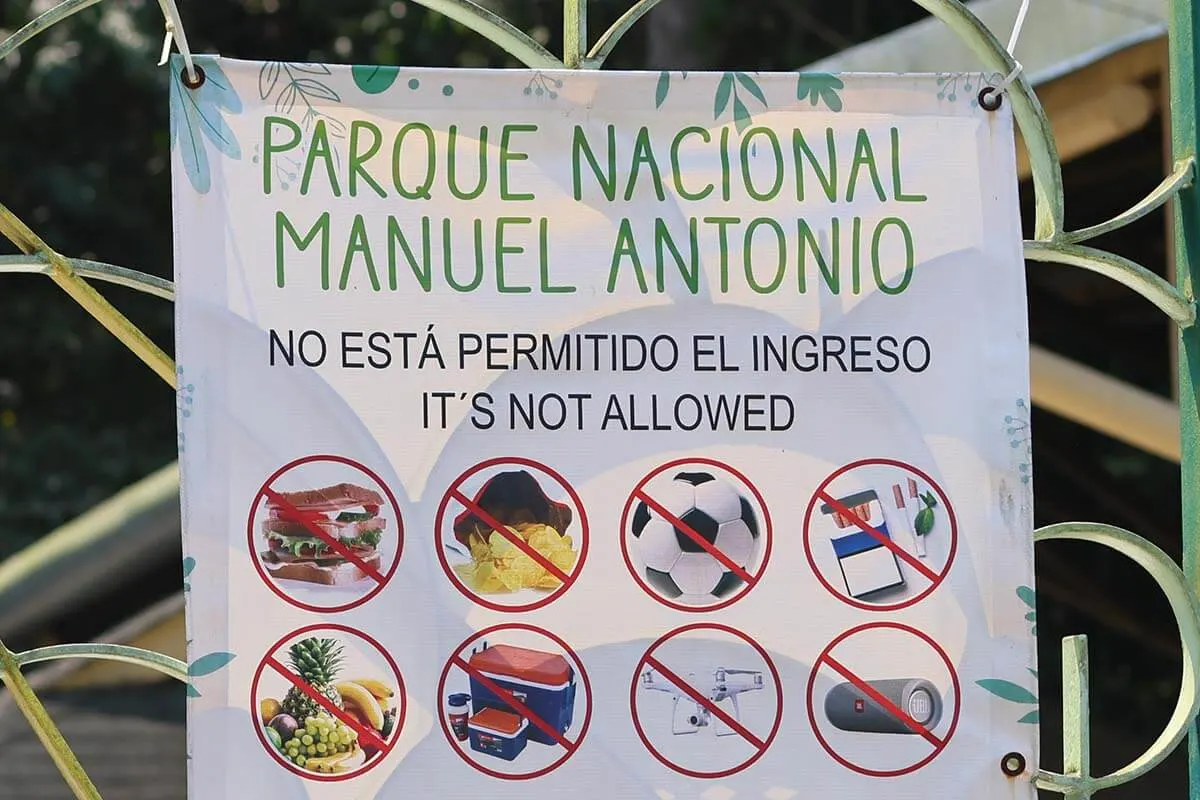 Sign showing which items are not allowed inside Manuel Antonio National Park in Costa Rica
