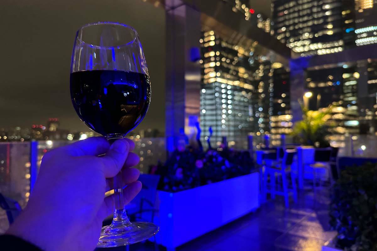 A glass of wine at a rooftop bar in New York City USA