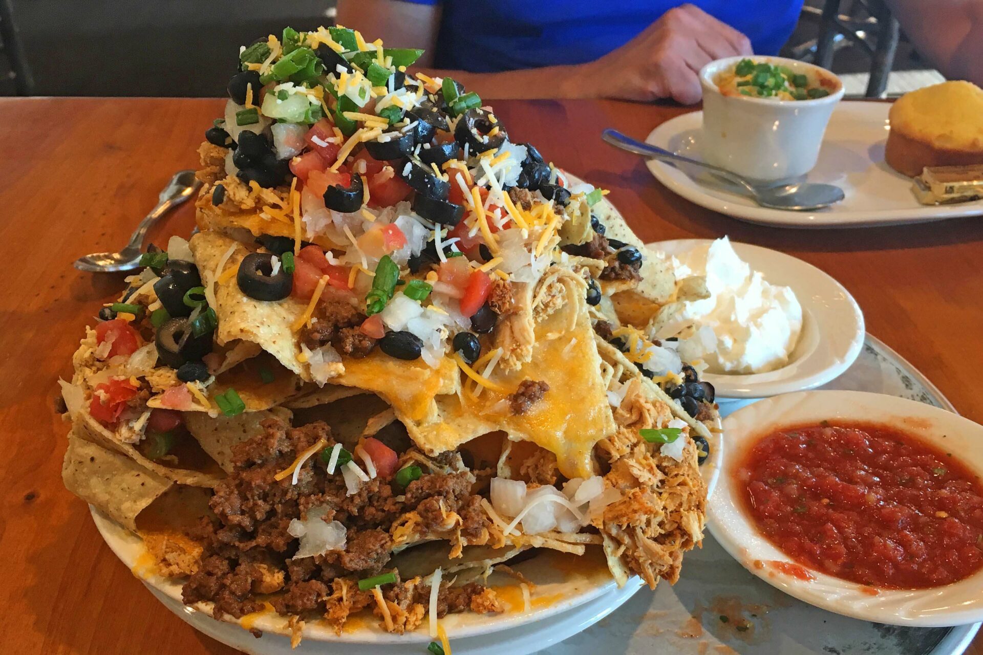 An oversized portion of nachos in a restaurant in the USA