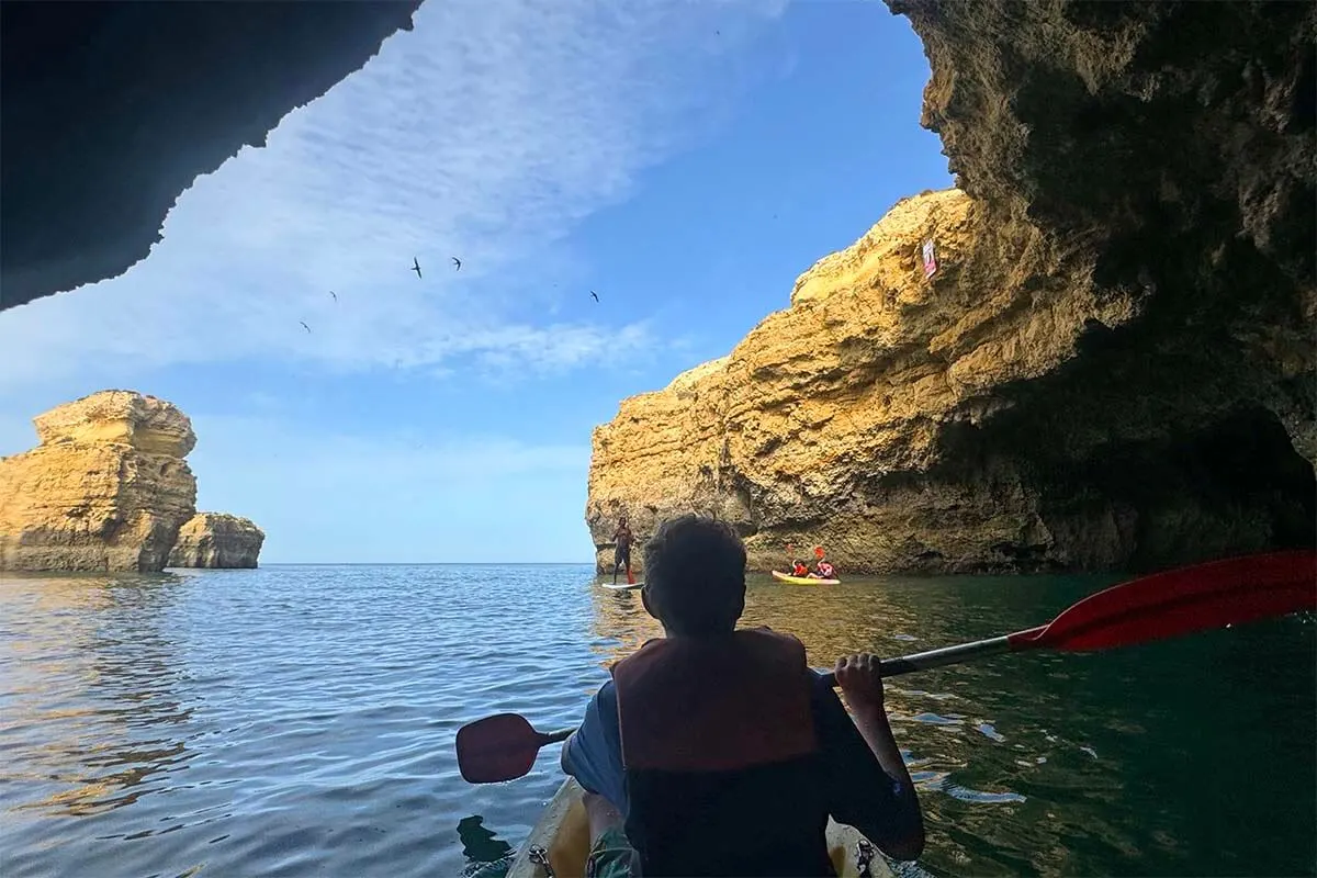 Kayaking inside sea caves near Albufeira in Portugal