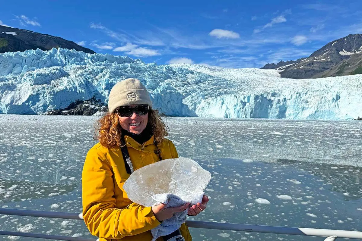 Jurga holding a big chunk of ice at a calving glacier in Seward Alaska