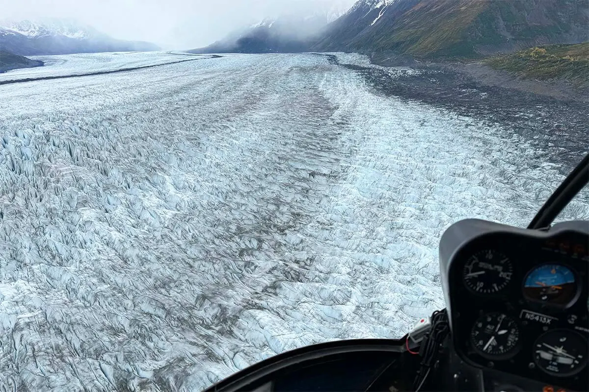 Alaska Knik Glacier aerial view from helicopter flying directly above it