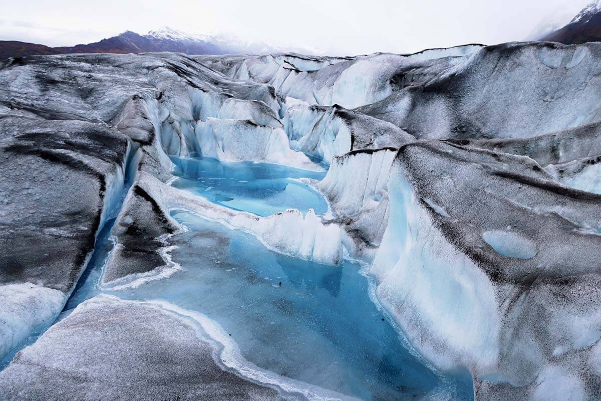 Blue pools on Knik Glacier - most epic day trip from Anchorage Alaska