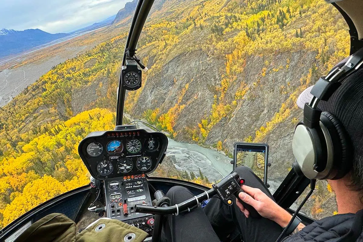 Helicopter flying over Knik River Valley in Alaska