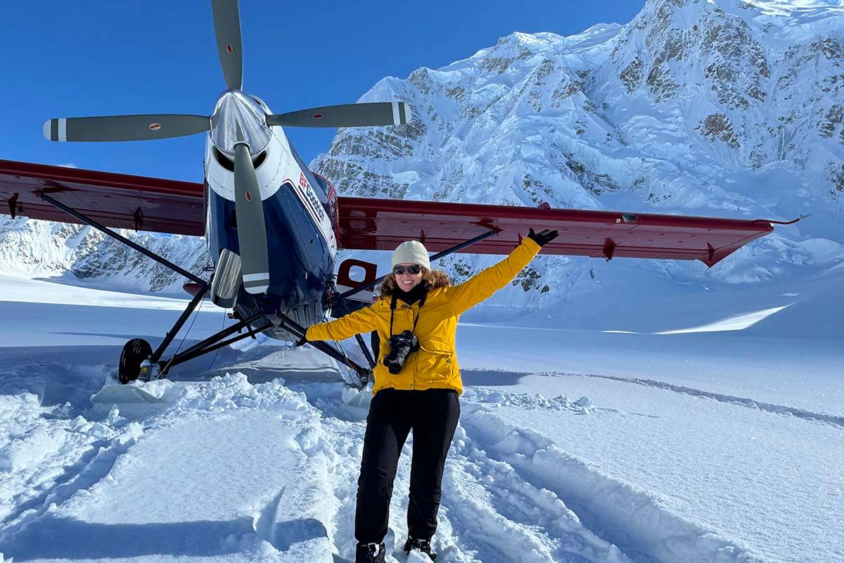 Mt Denali flight from Talkeetna glacier landing - Jurga standing in front of an airplane on the snow