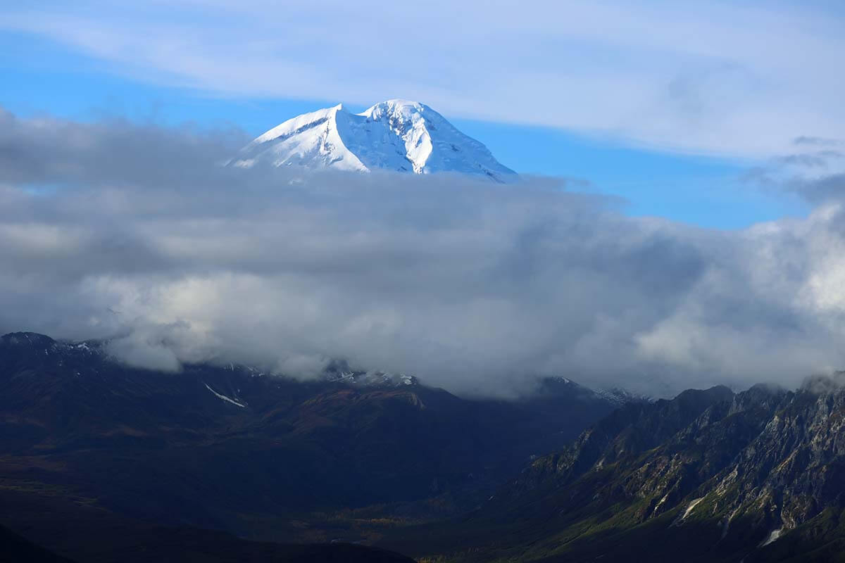 Mountain peak above the clouds - Lake Clark National Park and Preserve in Alaska