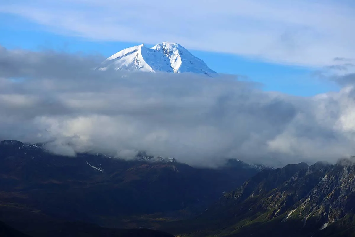 Mountain peak above the clouds - Lake Clark National Park and Preserve in Alaska