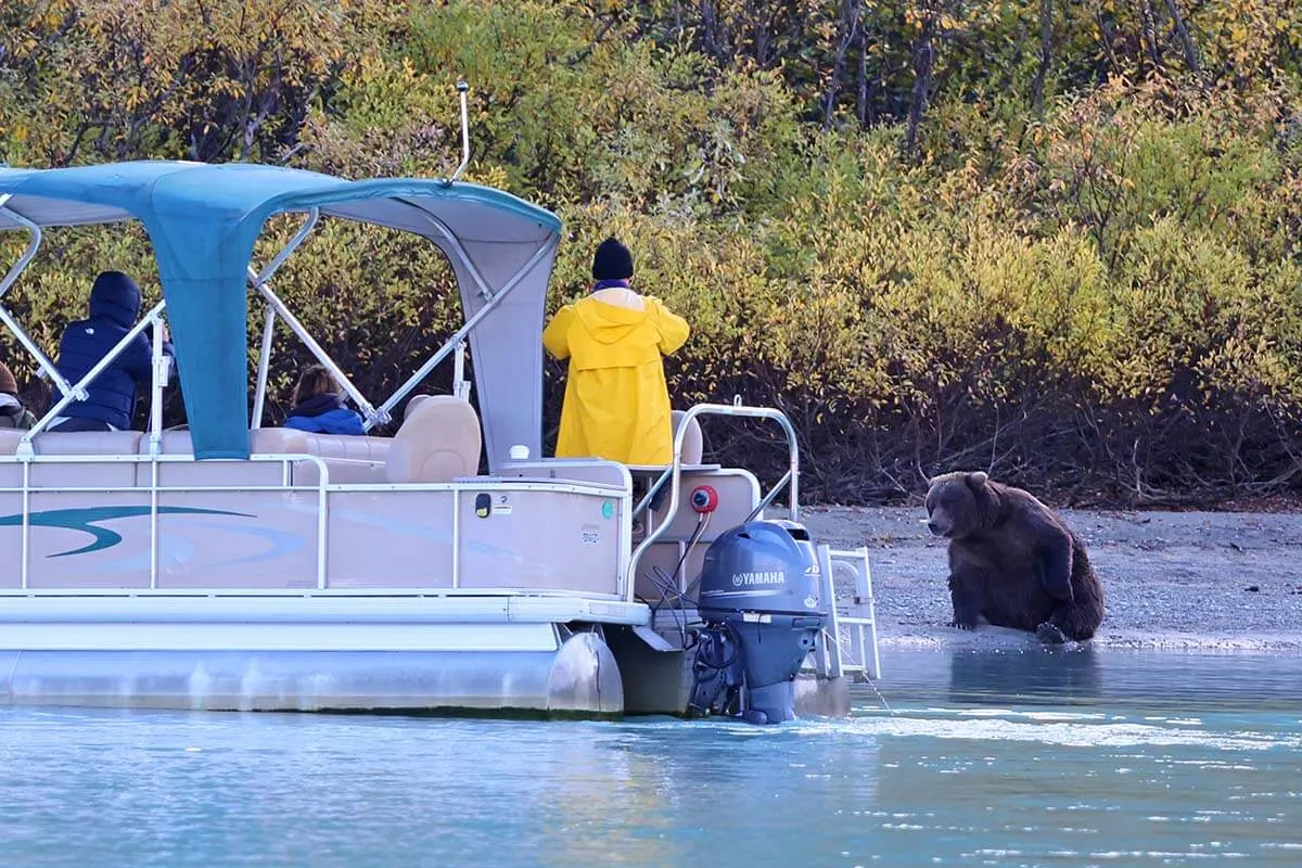 People watching bears from a small boat on Lake Crescent in Alaska