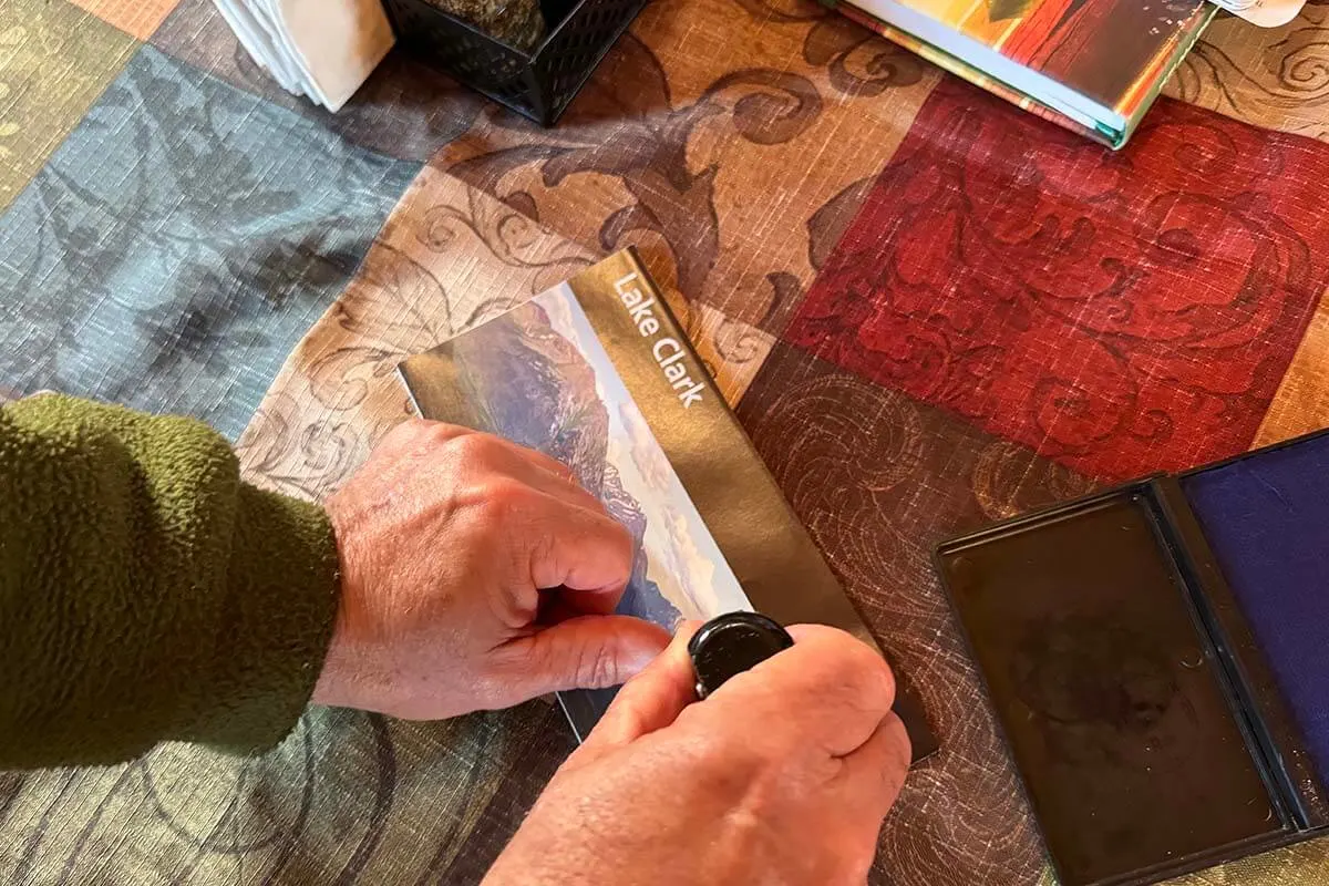 Stamping the Lake Clark National Park map in Alaska USA