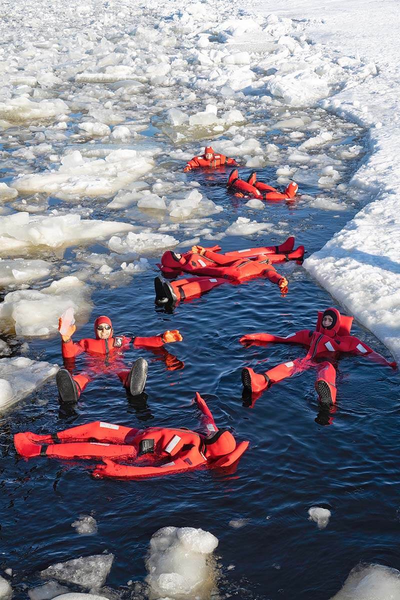 People ice floating on an ice breaker cruise in Lapland