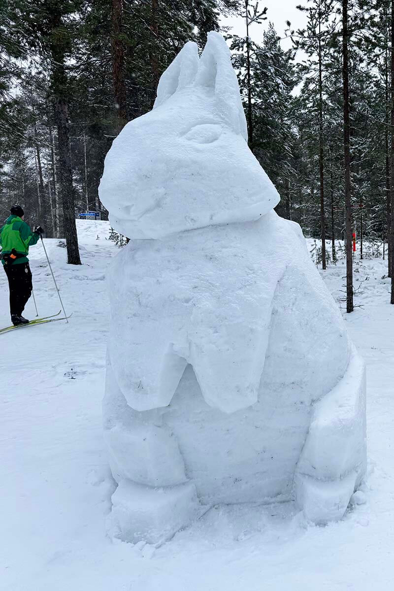 Snow sculpture and cross-country skier at Ounasvaara in Rovaniemi