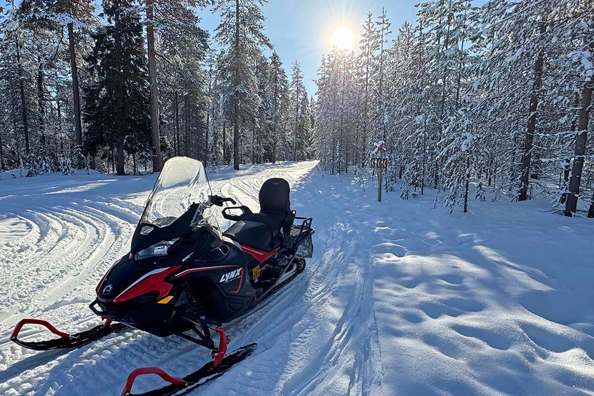 Snowmobile in a snowy forest in Lapland in winter