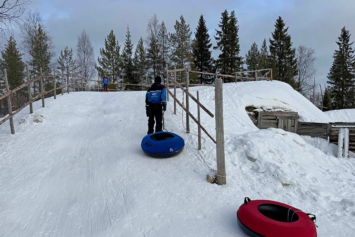 Snow tubing at Apukka resort Rovaniemi in winter