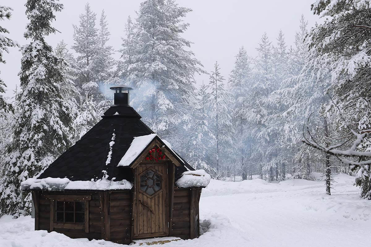 Traditional Finnish kota in a snowy forest in Lapland