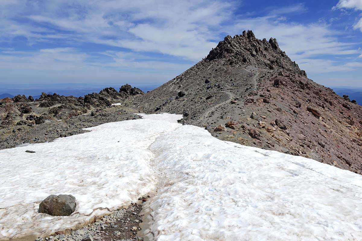 Mt Lassen peak and hiking trail with snow in summer