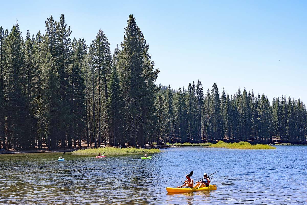People kayaking on Manzanita Lake in Lassen Volcanic National Park in summer