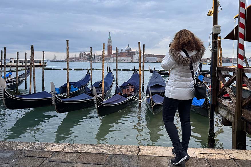Tourist wearing warm clothes and sorel winter sneakers in Europe in winter