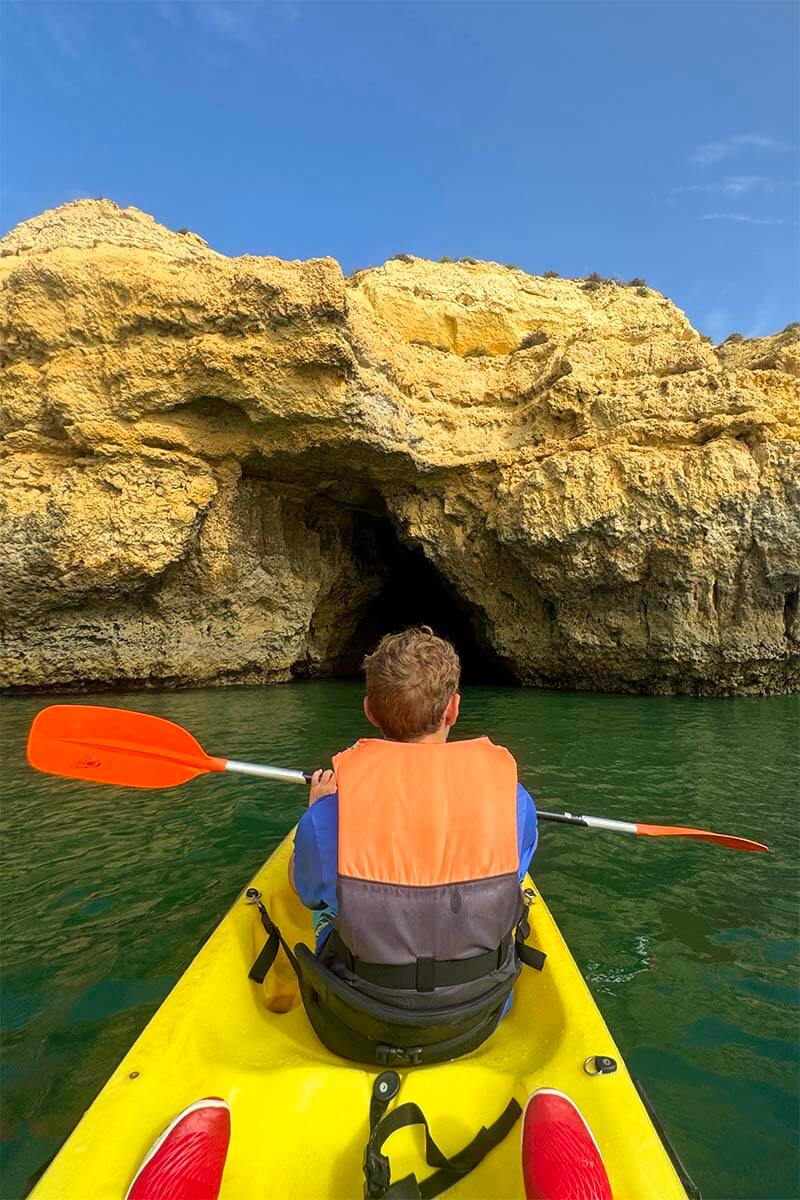 Teenager kayaking on the Algarve coast in Portugal