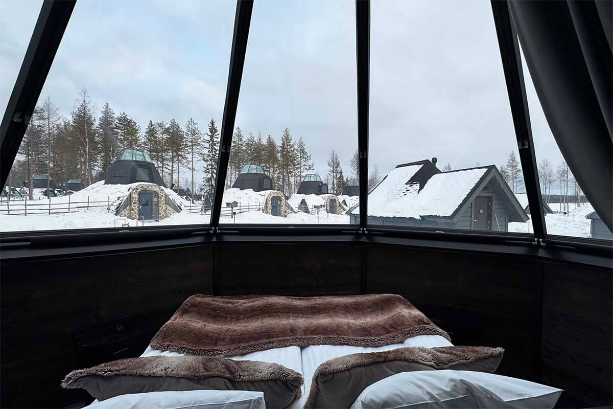 Cozy room inside a glass igloo at Apukka Resort near Rovaniemi in Lapland