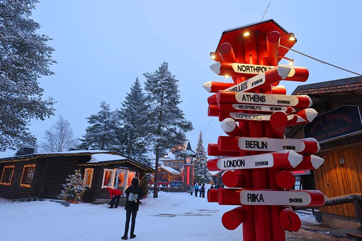 Distance sign at Santa Claus Village in Rovaniemi in winter