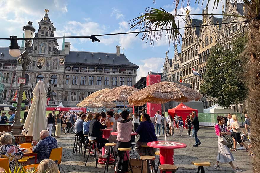 People enjoying sunshine and drinks on the main town square in Antwerp Belgium