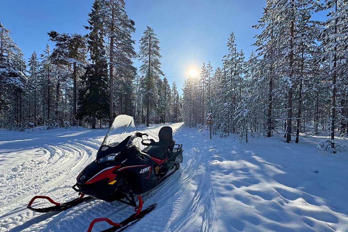 Snowmobile in a snowy forest in Lapland in winter