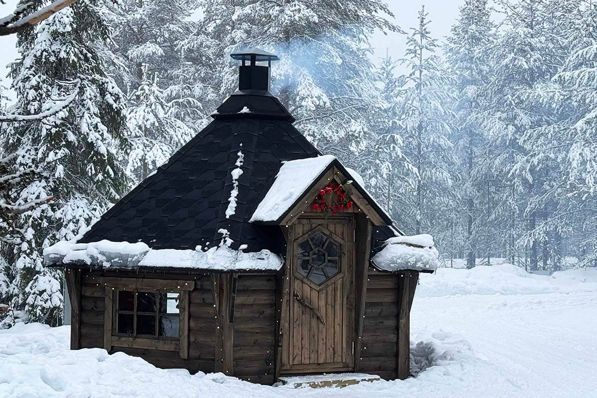 Traditional kota (Lappish hut) in a snowy forest in Lapland in winter