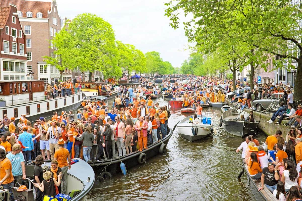 King's Day celebration and crowds in Amsterdam in April