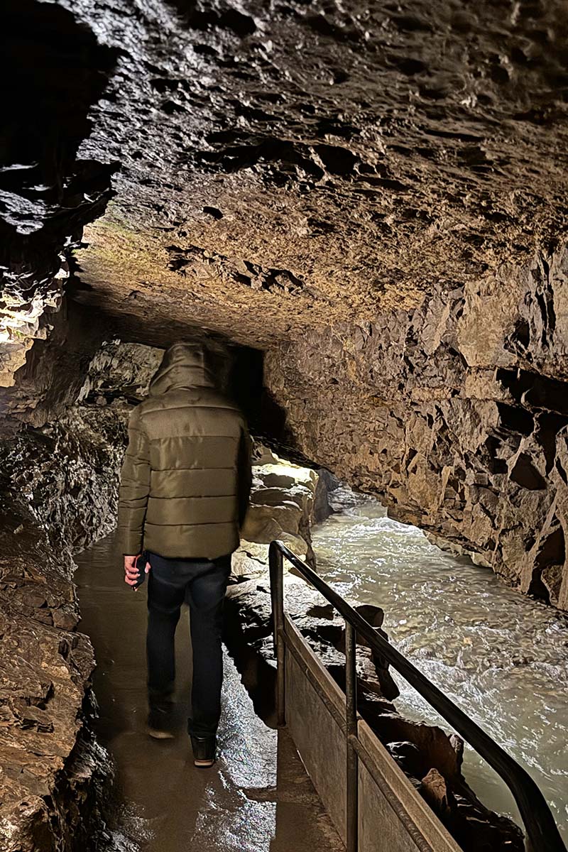 Tourist walking inside St Beatus Caves in Switzerland
