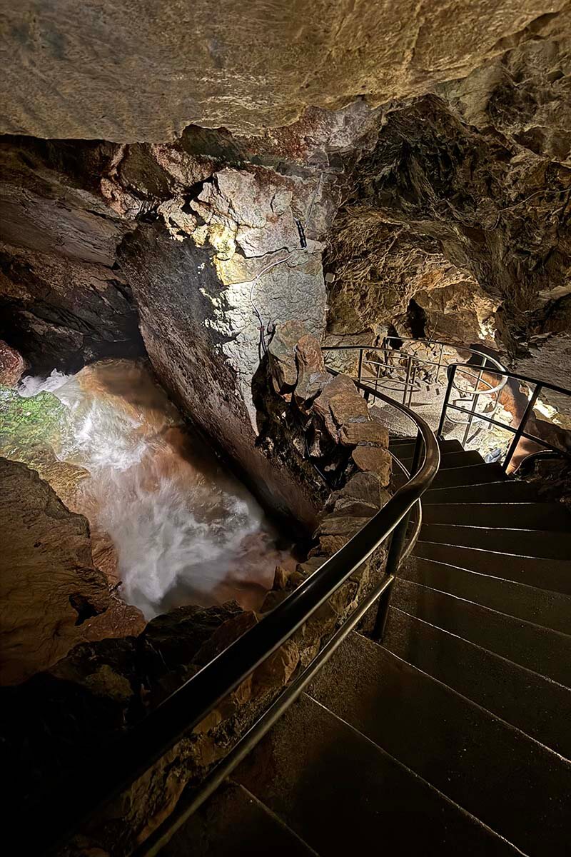 Underground river and staircase inside St Beatus Swiss Caves