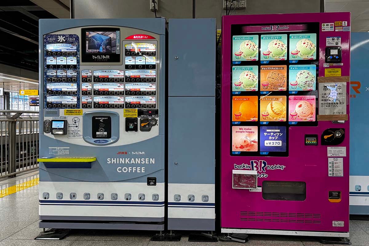 Japanese vending machines selling coffee and ice cream at a railway station