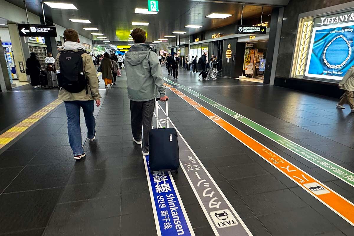Kyoto railway station - colored lines and floor markings guide you to the right trains