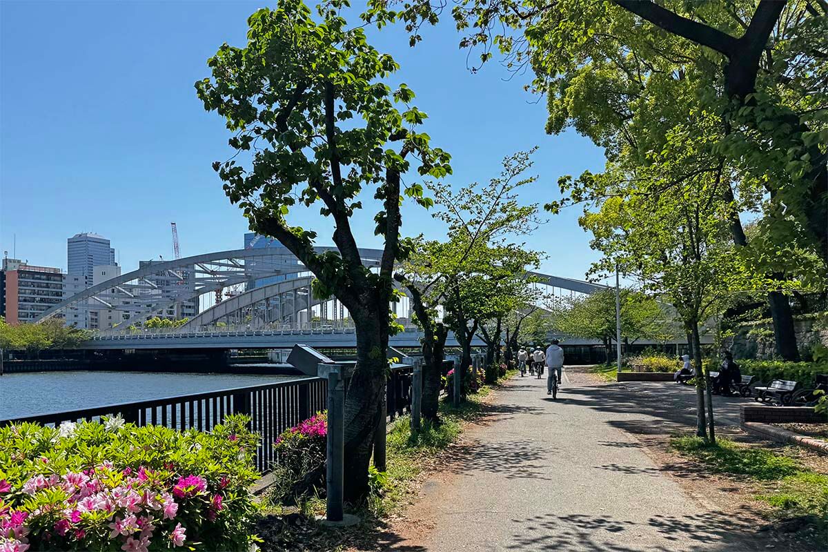 Osaka bike tour - biking next to the river