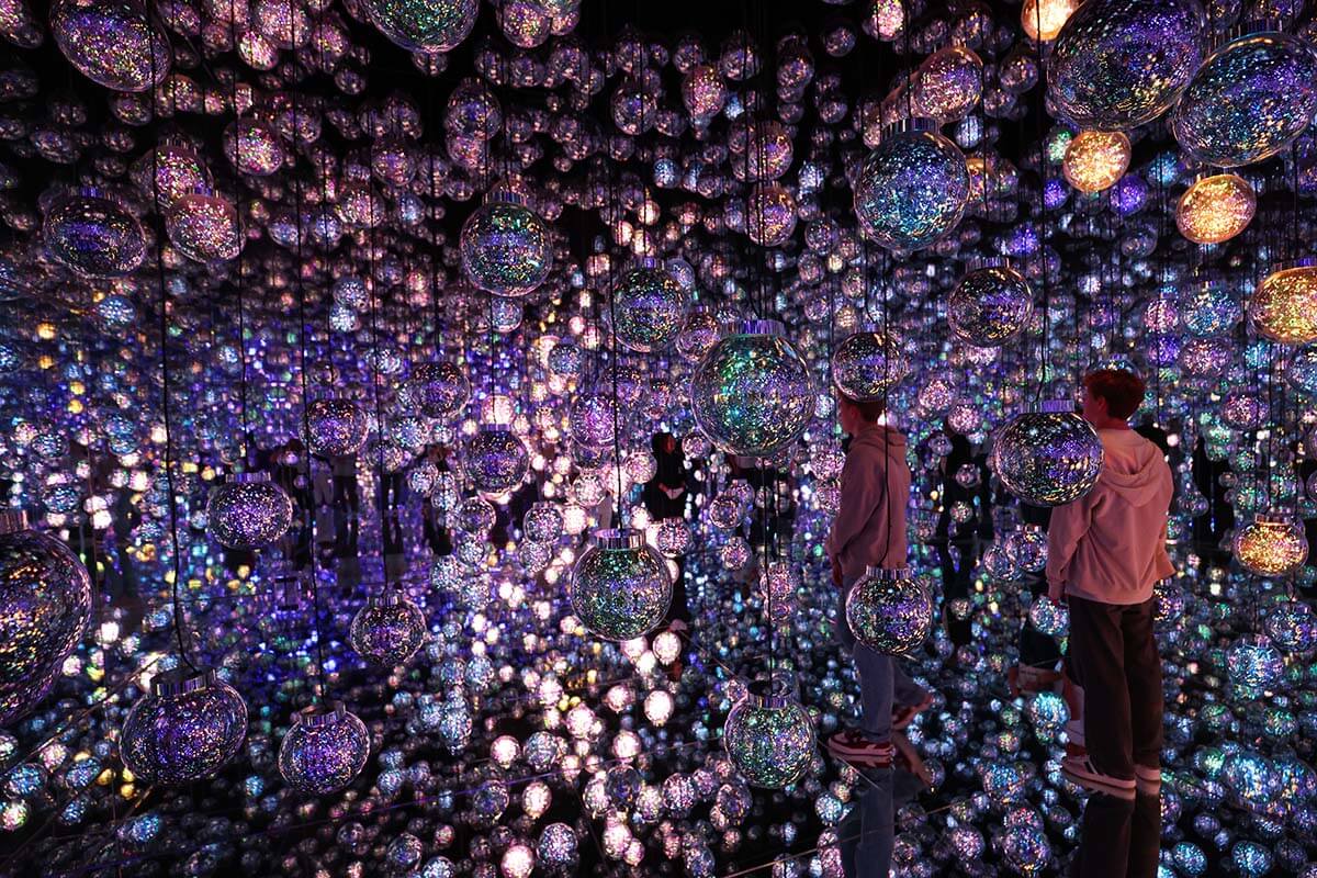 Teenagers at the teamLab Borderless in Tokyo Japan