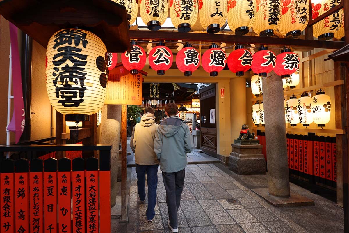 Teens at Nishiki Tenmangu Shrine in Kyoto Japan