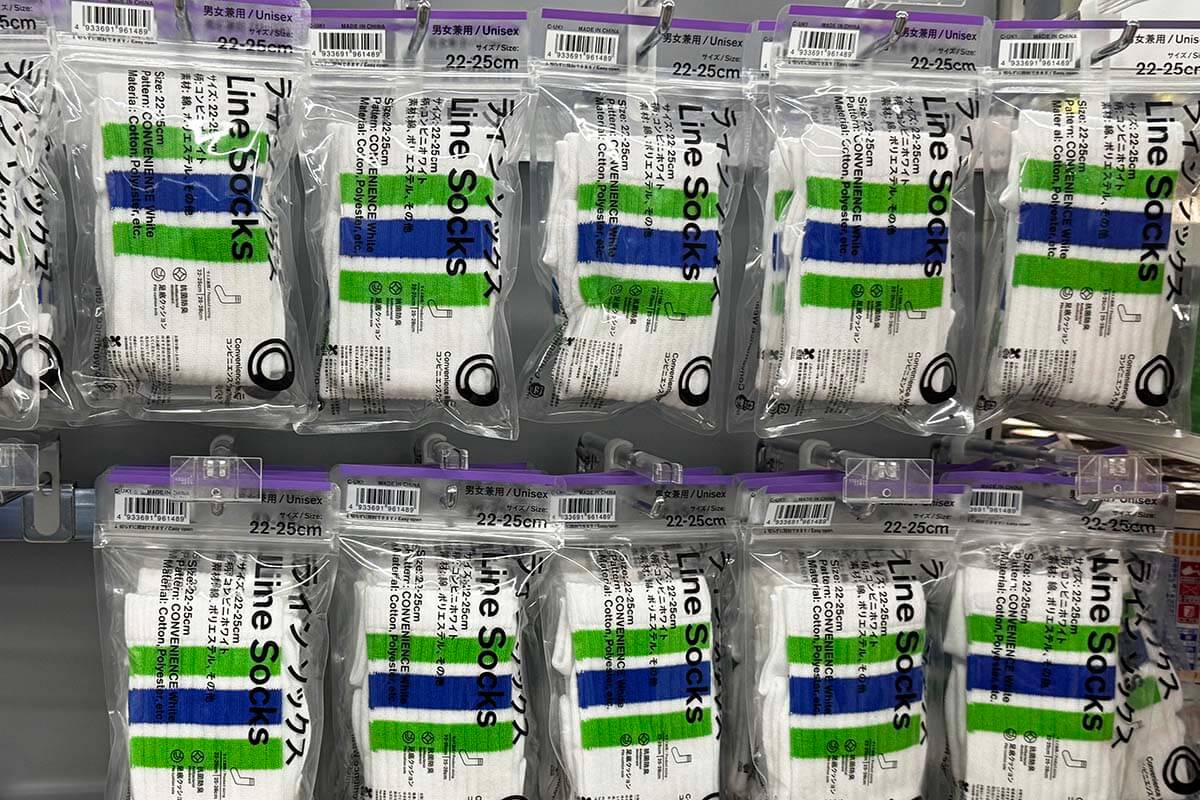 White line socks with green and blue stripes for sale at a FamilyMart convenience store in Japan
