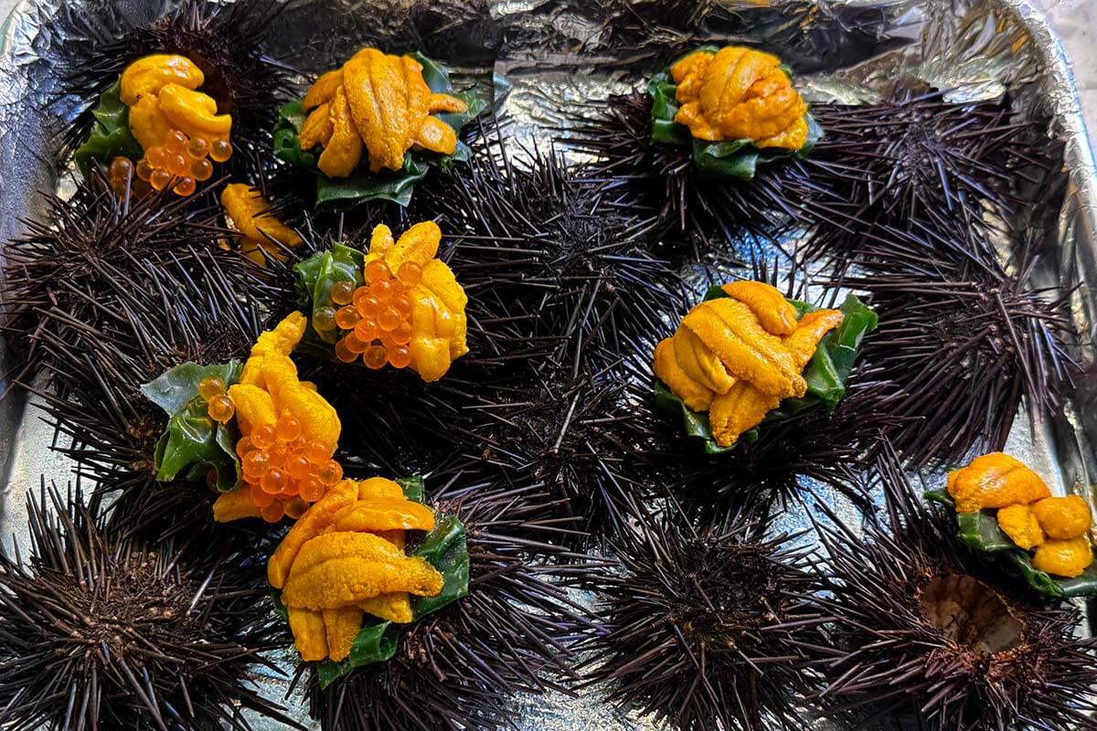 Fresh uni (sea urchin) served in its shell at Nishiki Market in Kyoto