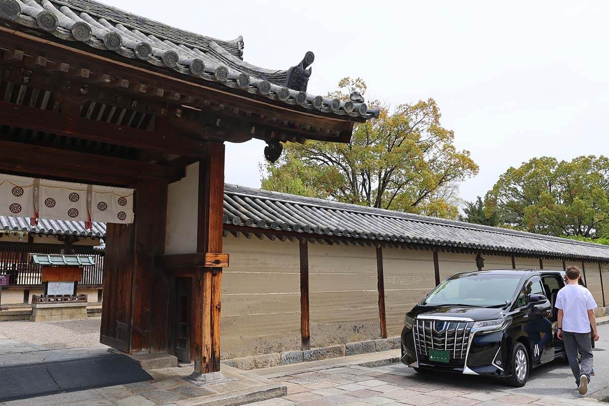 Luxury van waiting at an ancient temple on our Kyoto Nara day tour