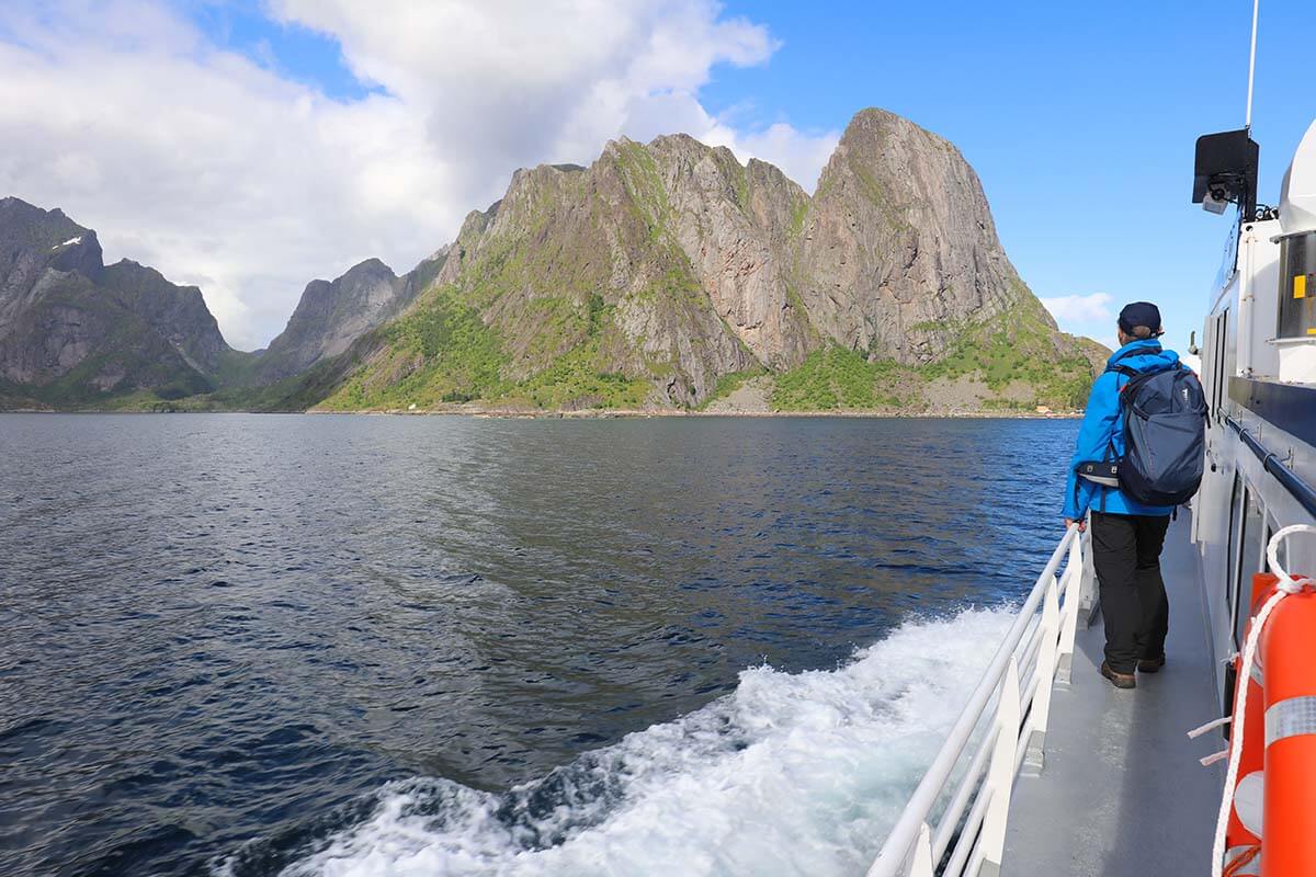 Person wearing a rain jacket on a boat trip in the Lofoten Islands, Norway