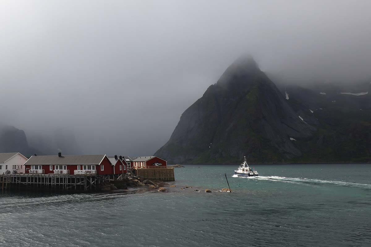 Reinefjord and Eliassen Rorbuer in foggy and rainy weather in Hamnøy, Lofoten Islands, Norway
