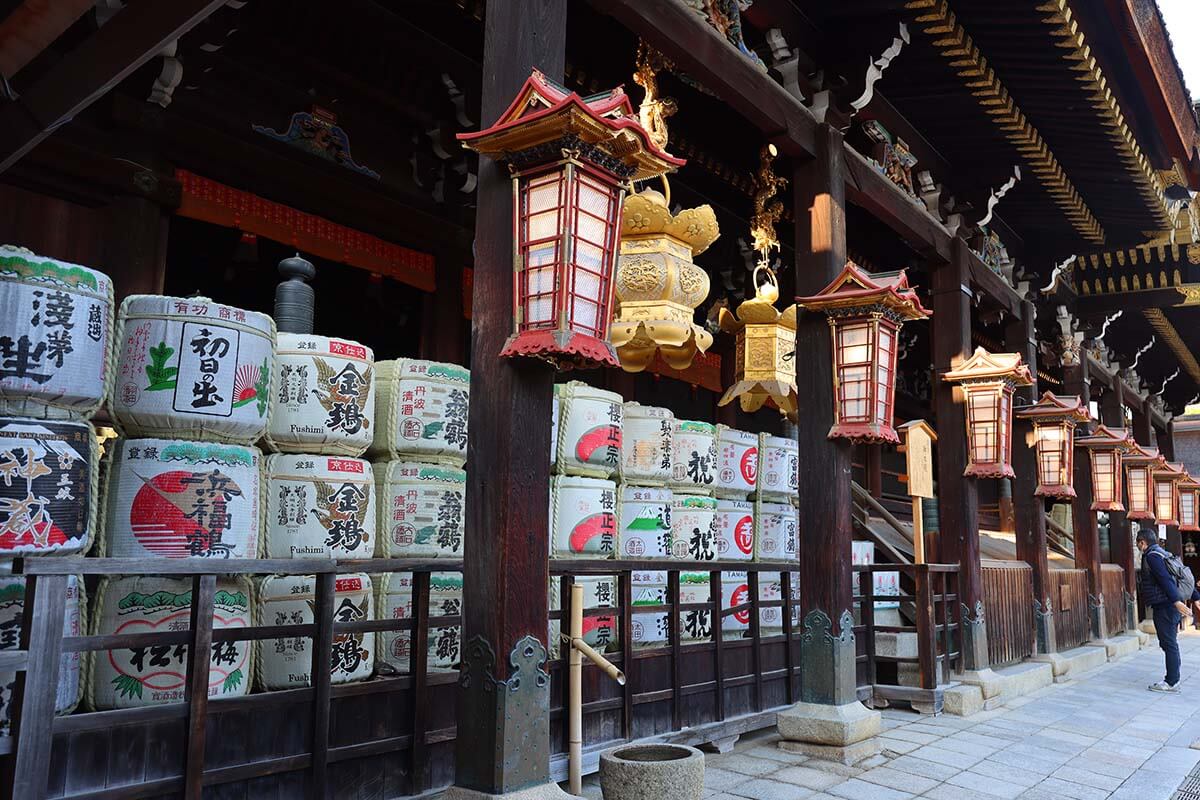 Sake barrels and lanterns at Kitano Tenmangu shrine in Kyoto