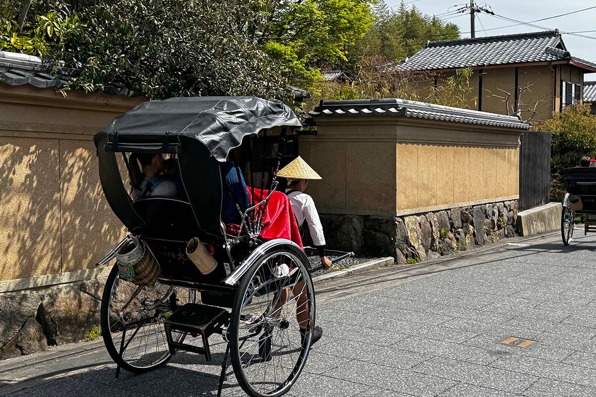 Traditional Japanese rikshaw (jinkirisha) on Saga-Toriimoto preserved street in Kyoto