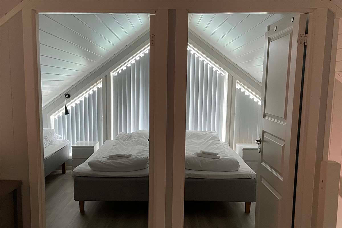 Traditional rorbuer cabins in Lofoten during summer with bright evening light entering through the windows