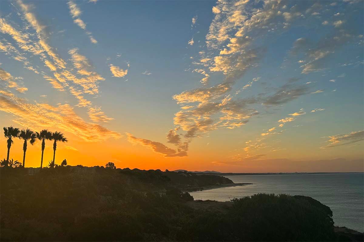 Algarve sunrise above the mountains and the sea in June