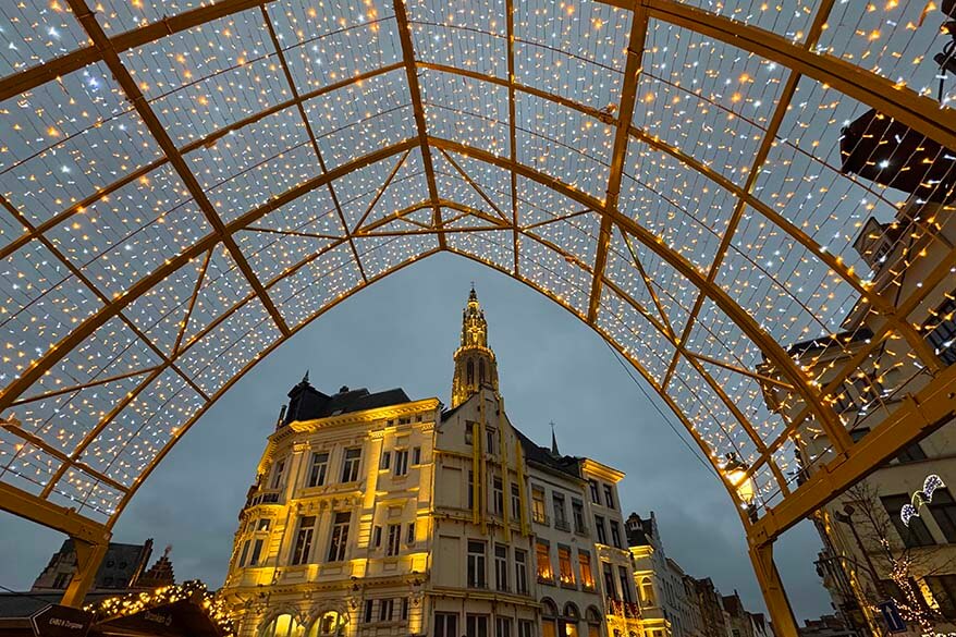 Christmas light canopy in Antwerp Old Town with historic buildings.